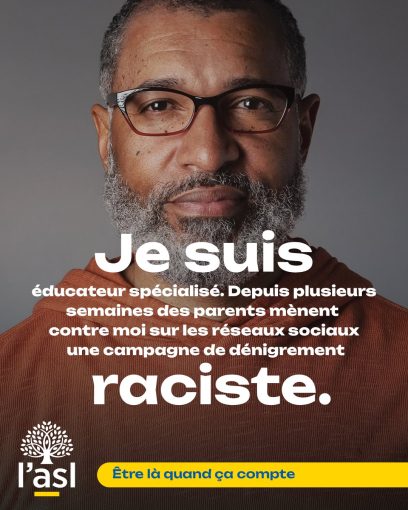Portrait homme noir avec une barbe grise qui porte des lunettes